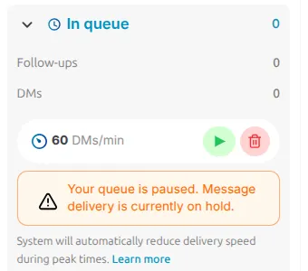 LinktoDM In queue panel in the paused state, warning that the queue is paused and message delivery is currently on hold, with a green resume button in place of pause